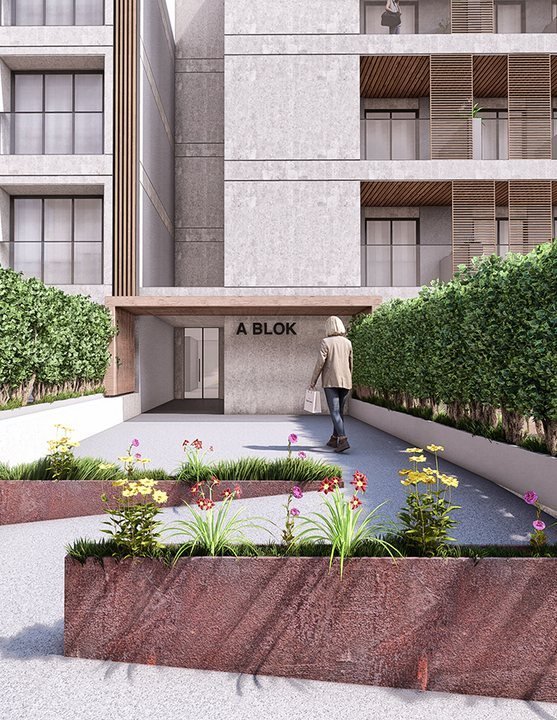 Biga Avlu — A Blok girişi ve çiçekli dikim seti