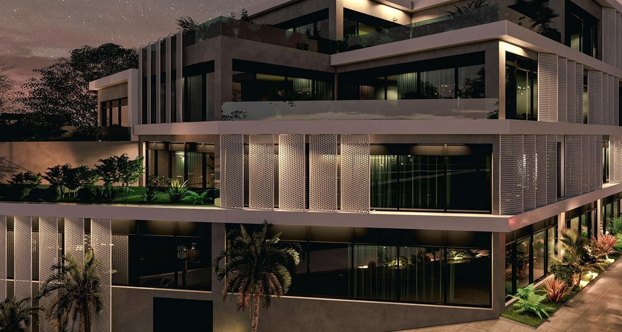 Zaha Pyramid Office — gece; aydınlanan ofis katları ve teras bahçeleri